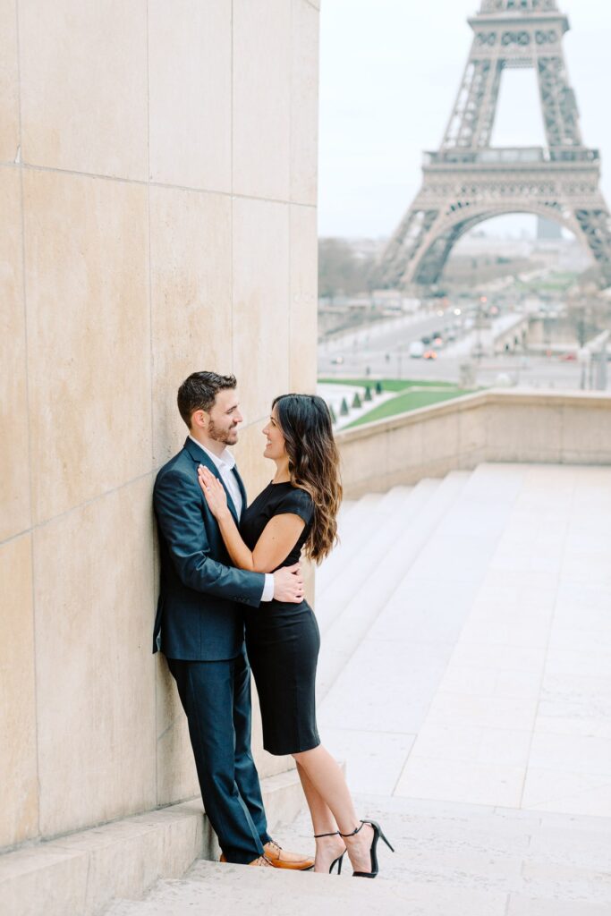 couple in front of the eiffel tower after surprise proposal in paris