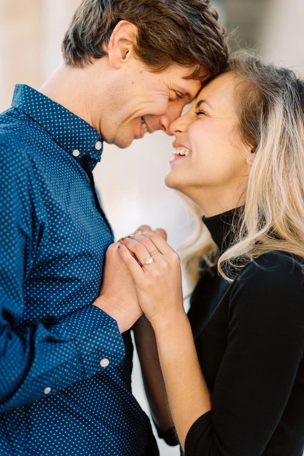 smiling couple at engagement session in paris