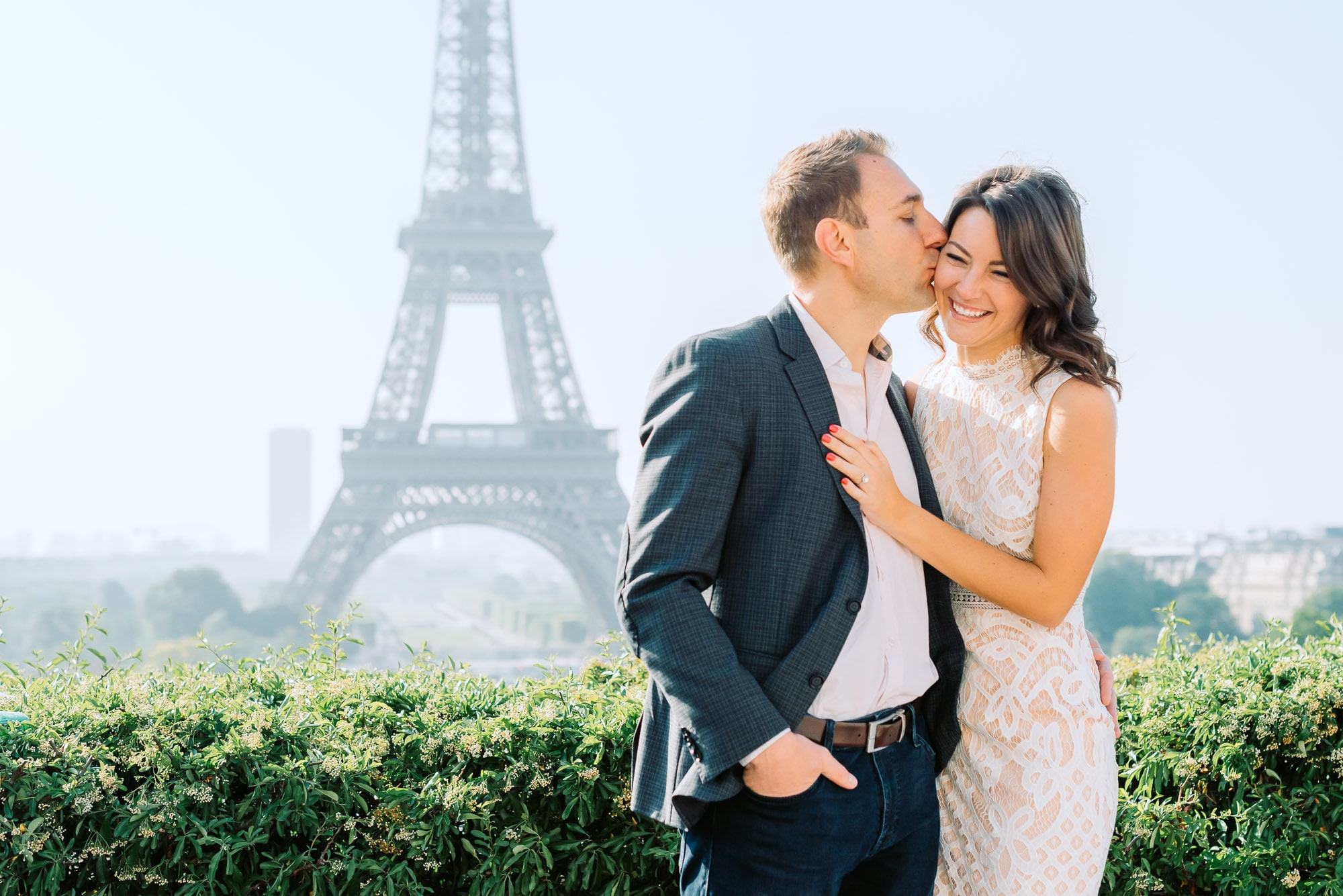 Couple standing in front of Eiffel Tower
