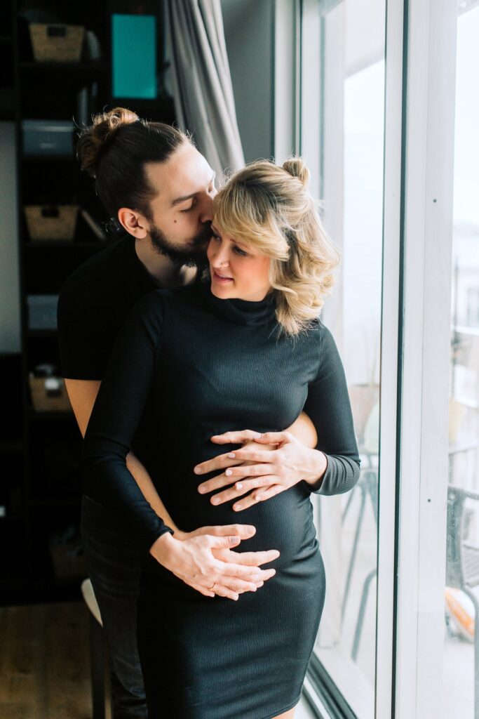 happy couple during maternity photo shoot in paris