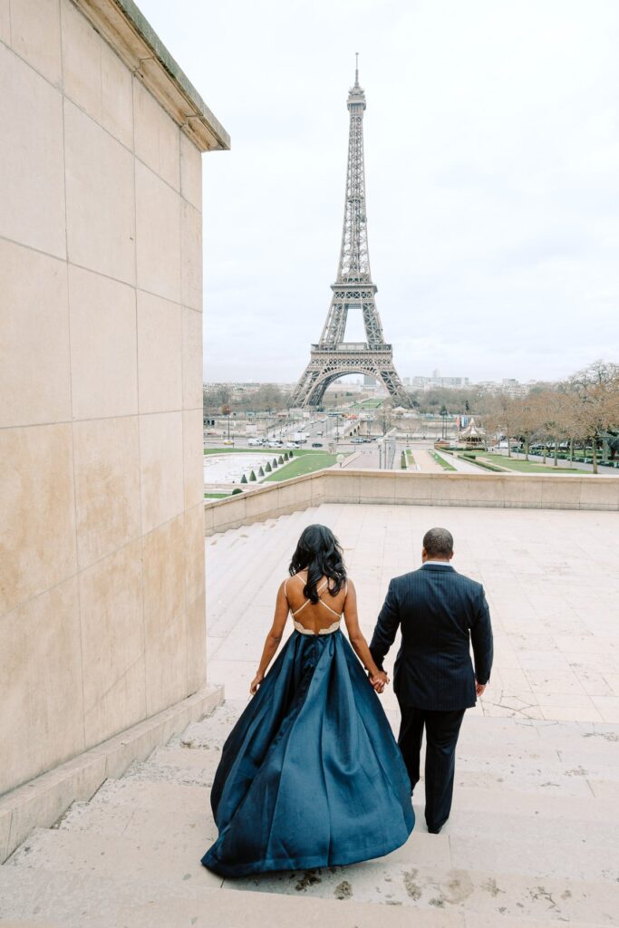 surprise proposal in front of the eiffel tower paris winter