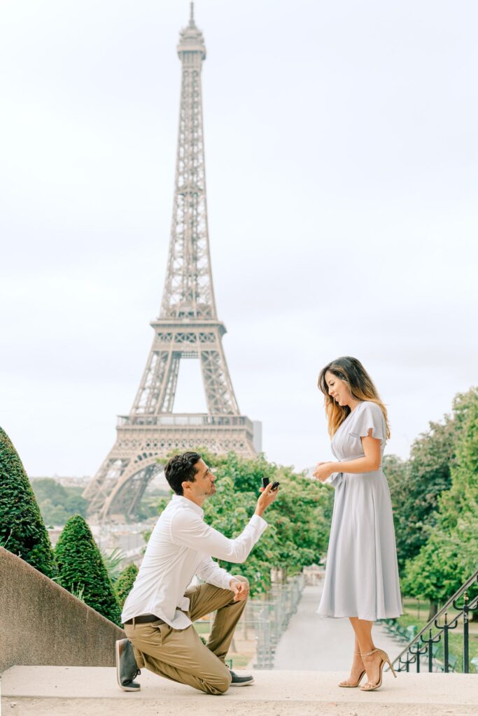 surprise proposal in front of the eiffel tower