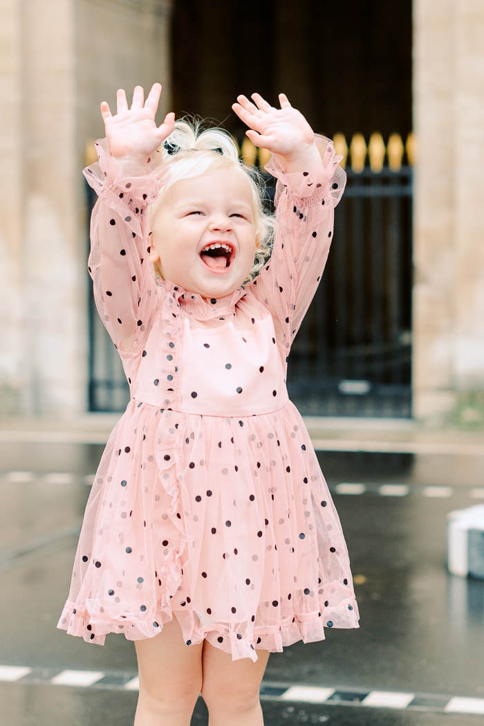 Happy toddler in the Louvre during a birthday photo session
