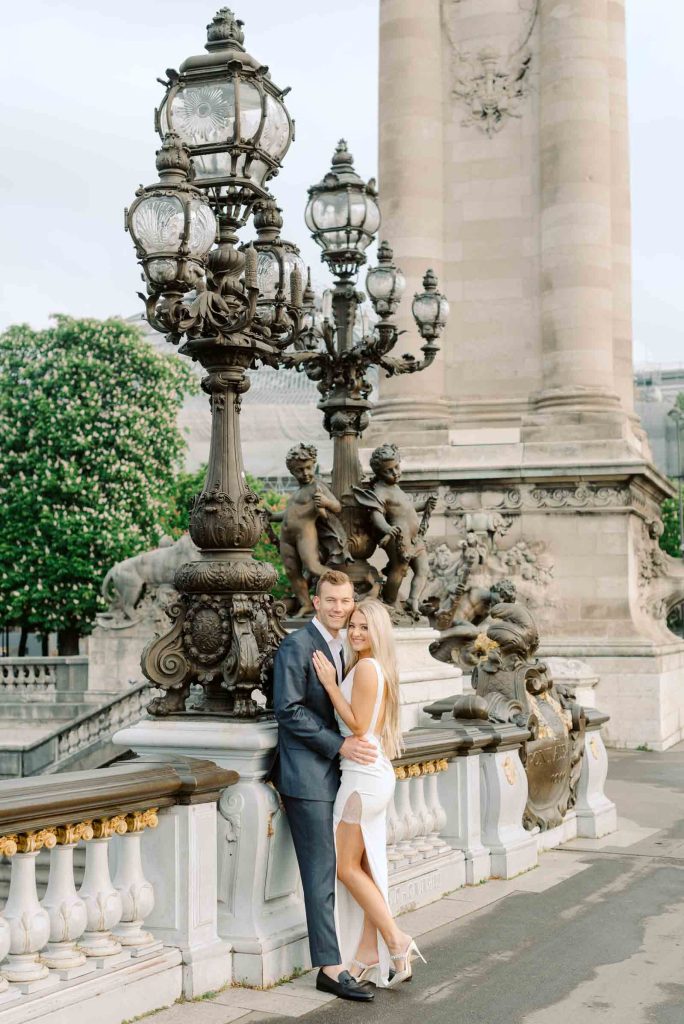 Beautiful engaged couple on Alexander III Bridge