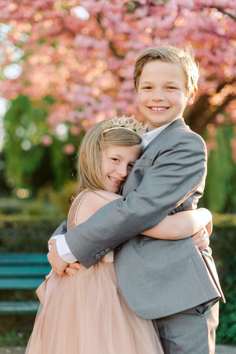 Kids hugging during family session in Paris France